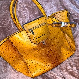 Mustard colored crocodile like handbag